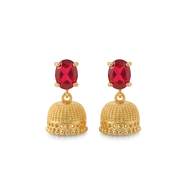 Gold earrings with red gemstones on a white background