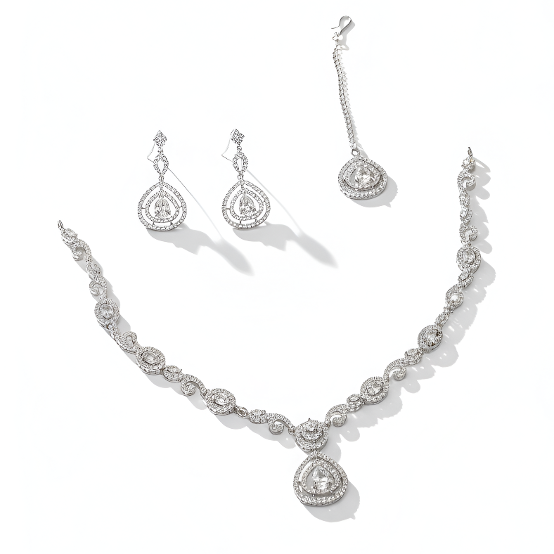 Silver necklace and earrings set on a white background