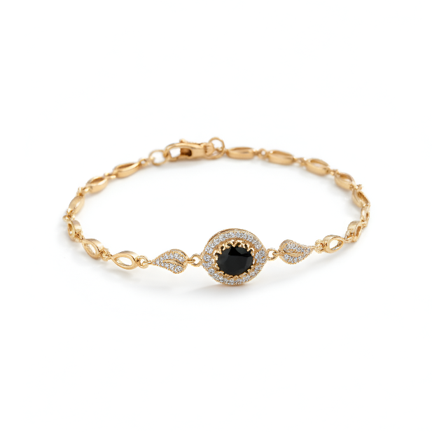 Gold bracelet with a black gemstone on a white background