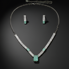 Jewelry set with necklace and earrings on a dark background