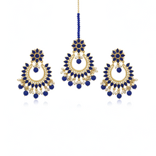 Set of blue and gold earrings on a white background