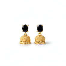Gold earrings with black gemstones on a white background