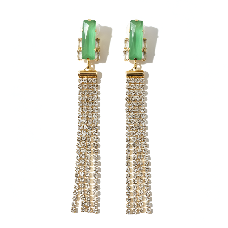 Pair of earrings with green tops and gold tassels on a white background